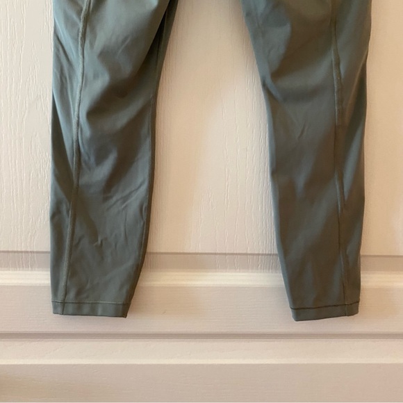 ATHLETA Ultimate Stash Pocket 7/8 Tight in Laurel Olive - SP - Picture 11 of 16